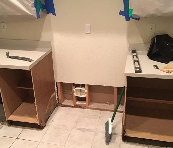 Removed drywall behind refrigerator 