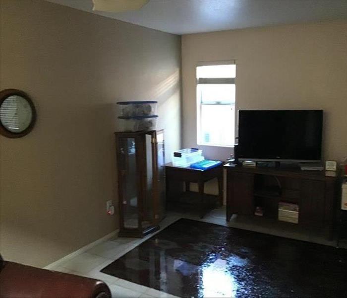 Living room flooded from ceiling water plumbing burst