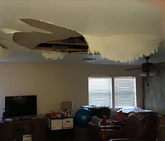 water damaged ceiling falling in living room