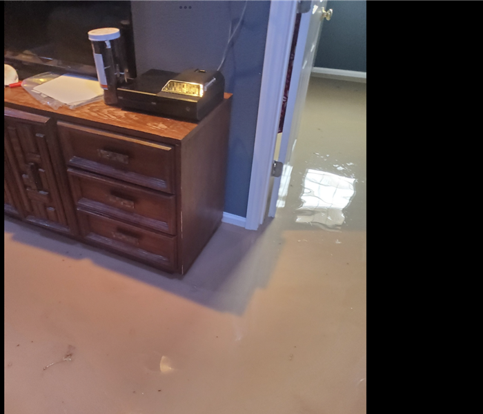 Flooded bedroom from flash flood