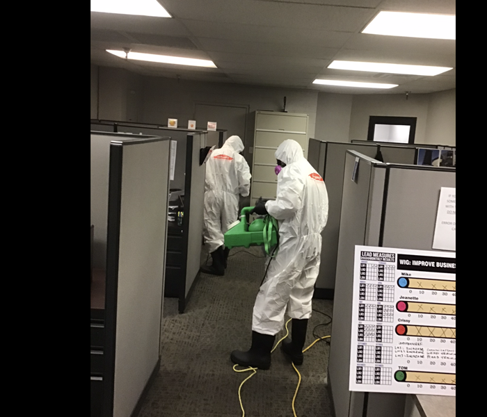 SERVPRO team disinfecting office space