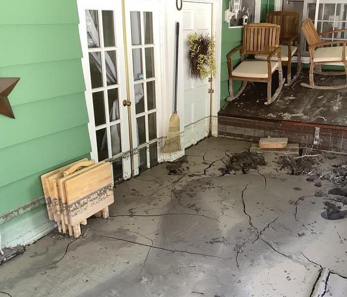 Home patio flooded with mud